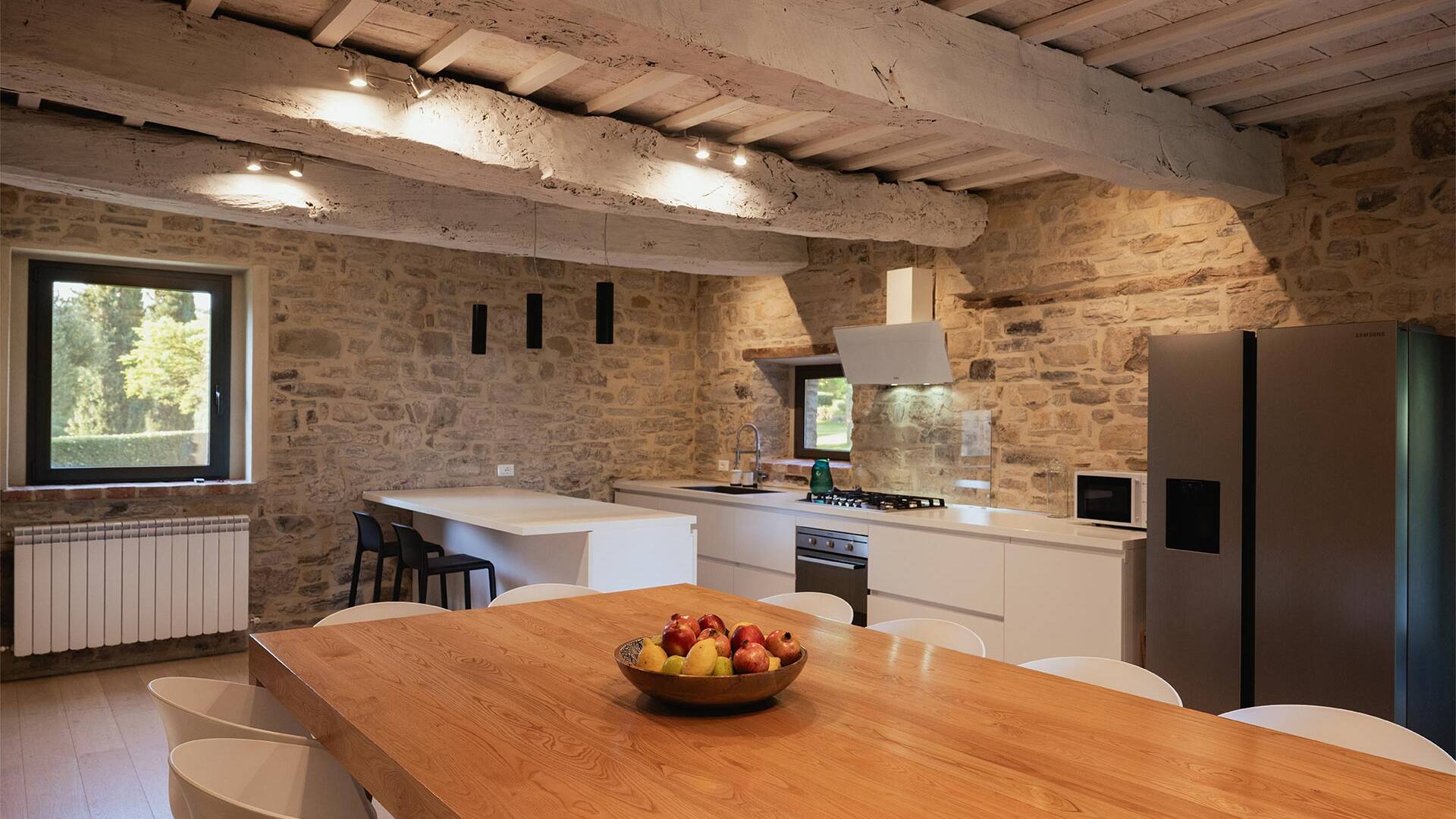 large dining table in the open space kitchen